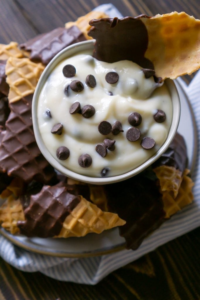 cannoli dip with waffle cone chips on a plate