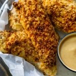 air fryer chicken tenders on white parchment paper with sauce