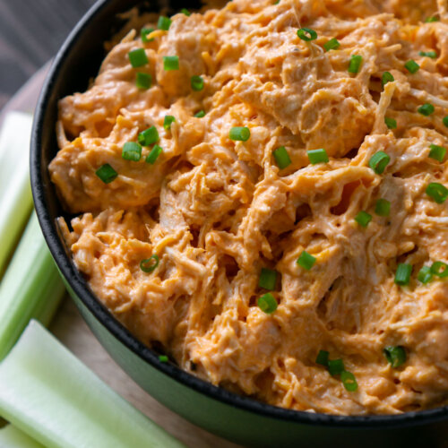 slow cooker buffalo chicken dip in a black bowl