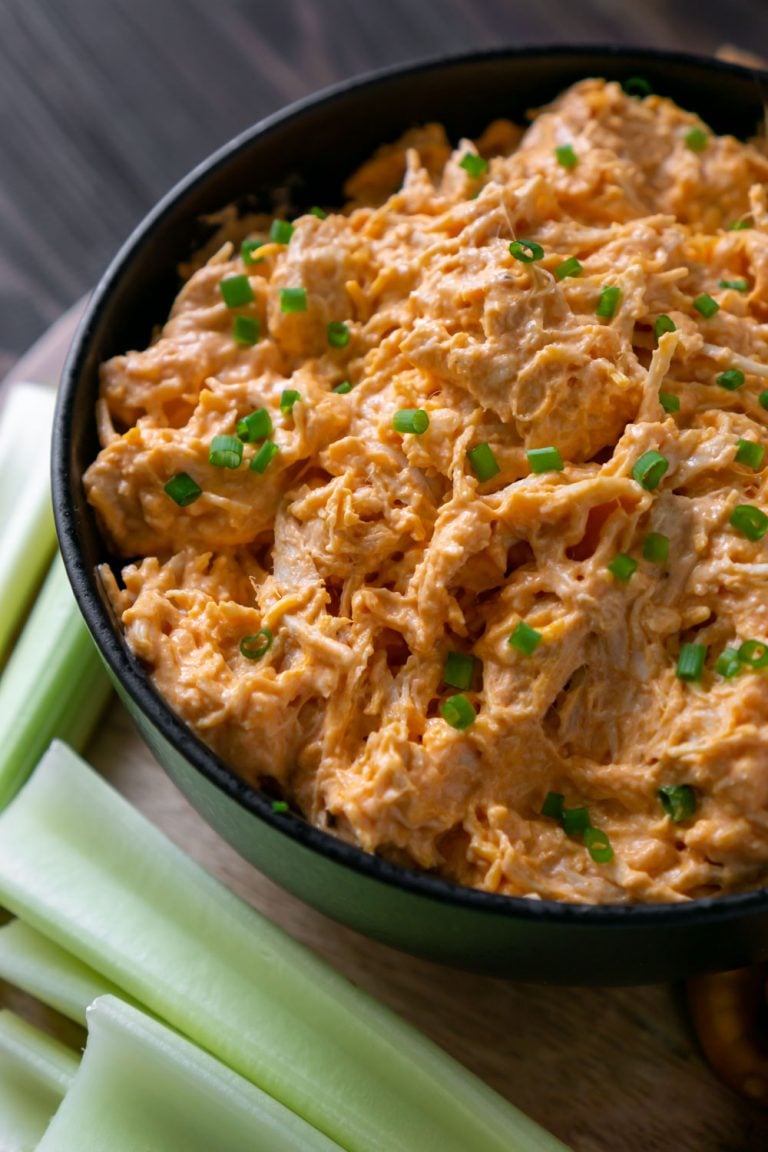 slow cooker buffalo chicken dip in a black bowl