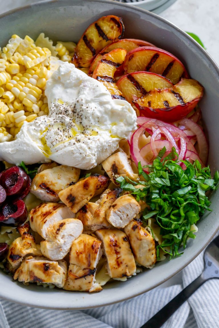 burrata corn, grilled peaches, basil, and chicken in a large bowl