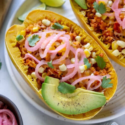 taco spaghetti squash boats on a white plate