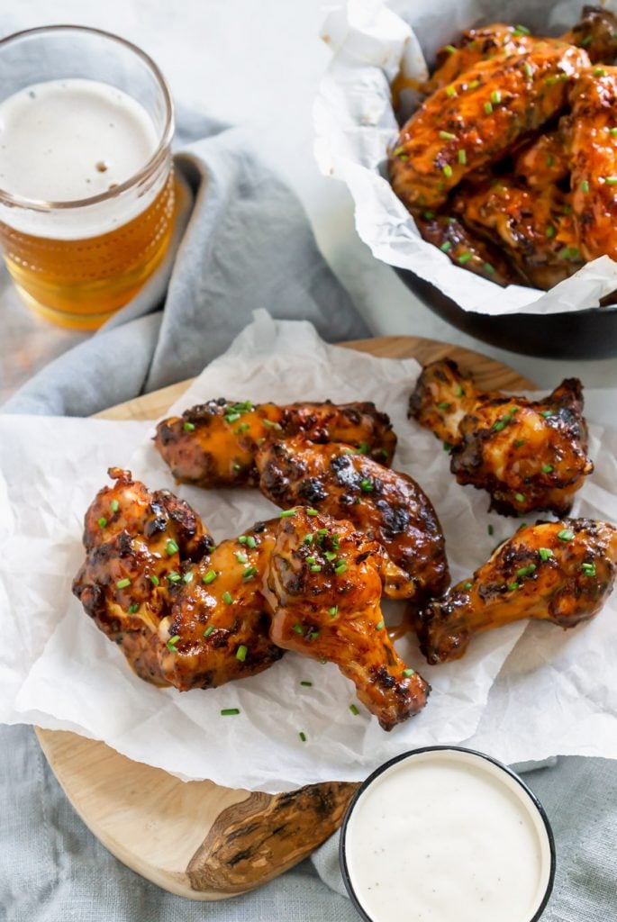 air fryer wings on parchment paper with beer
