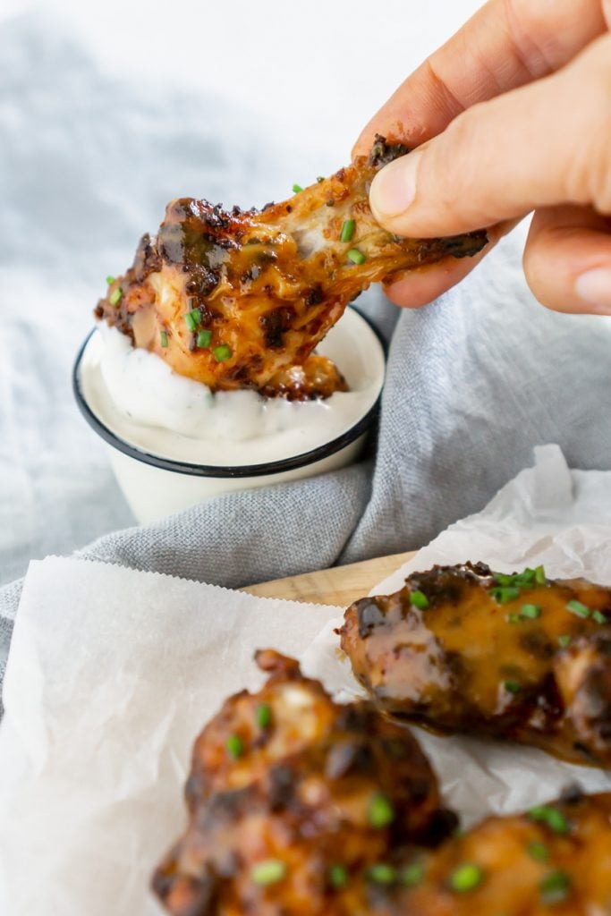 dipping a wing in ranch dressing