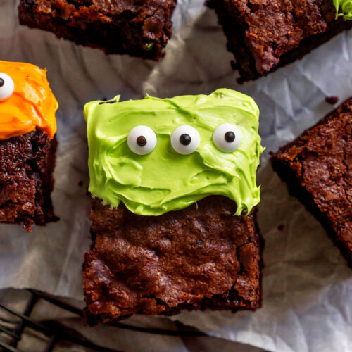 cake brownie with green frosting on a cooling rack