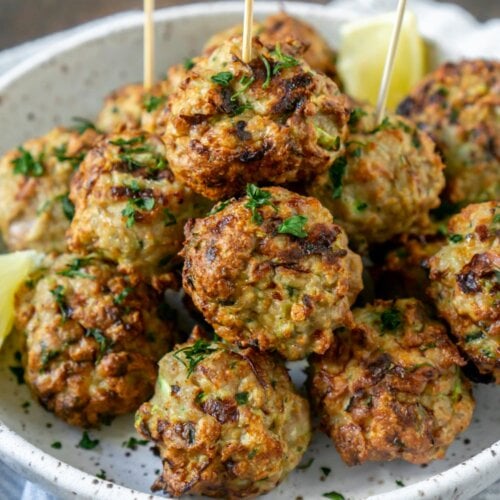 air fryer meatballs on a white plate with toothpicks