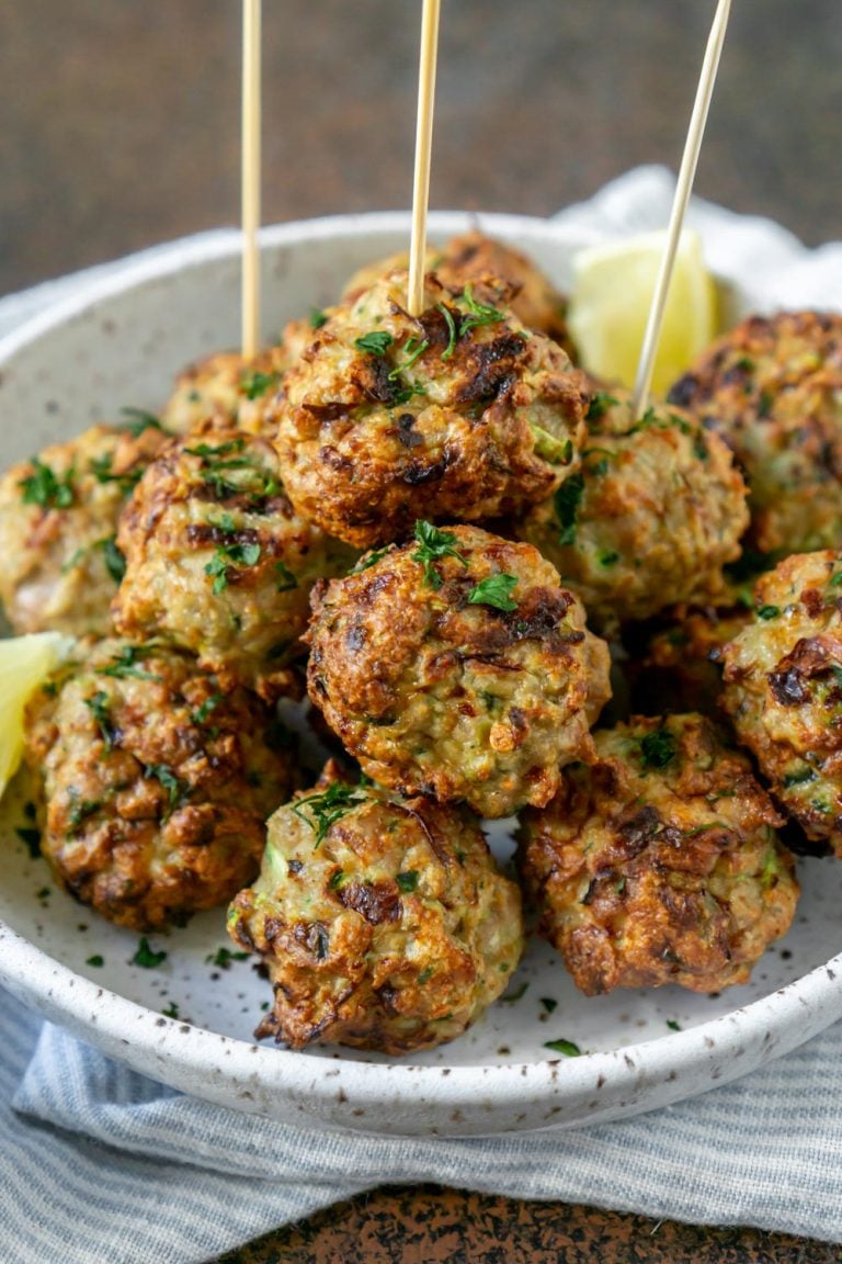 air fryer meatballs on a white plate with toothpicks