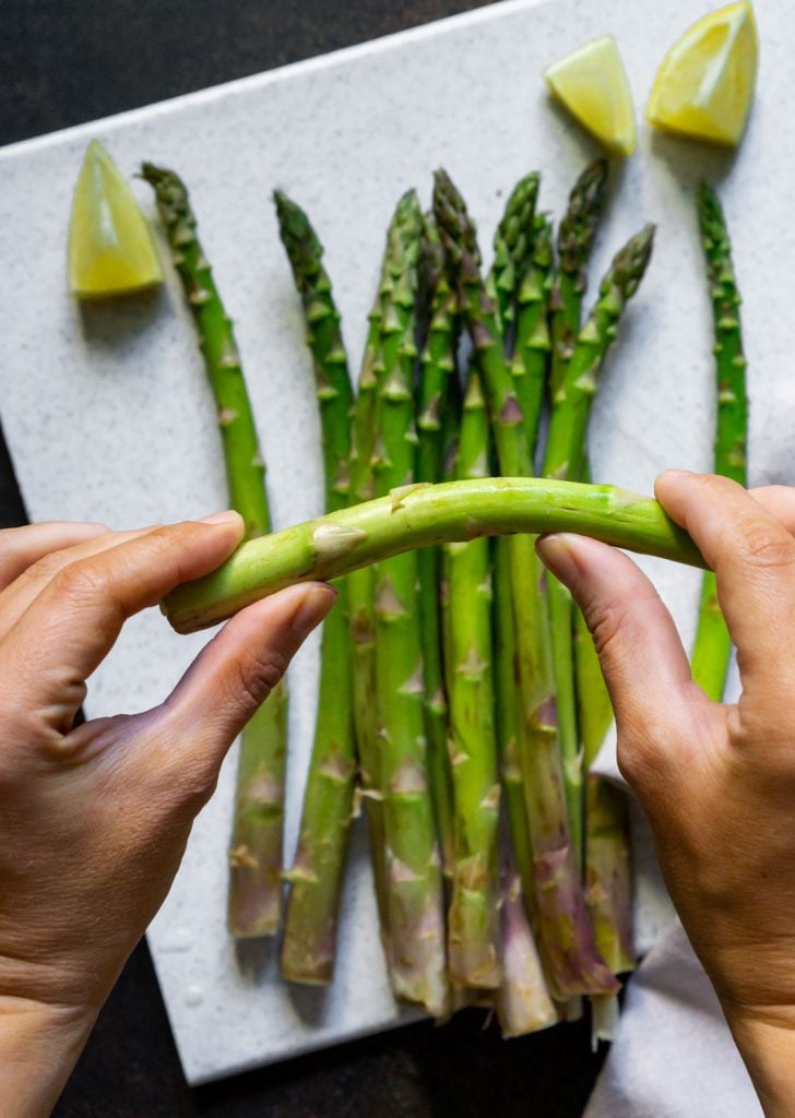 snapping ends off asparagus