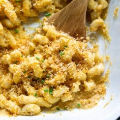 butternut squash mac and cheese on a wood spoon