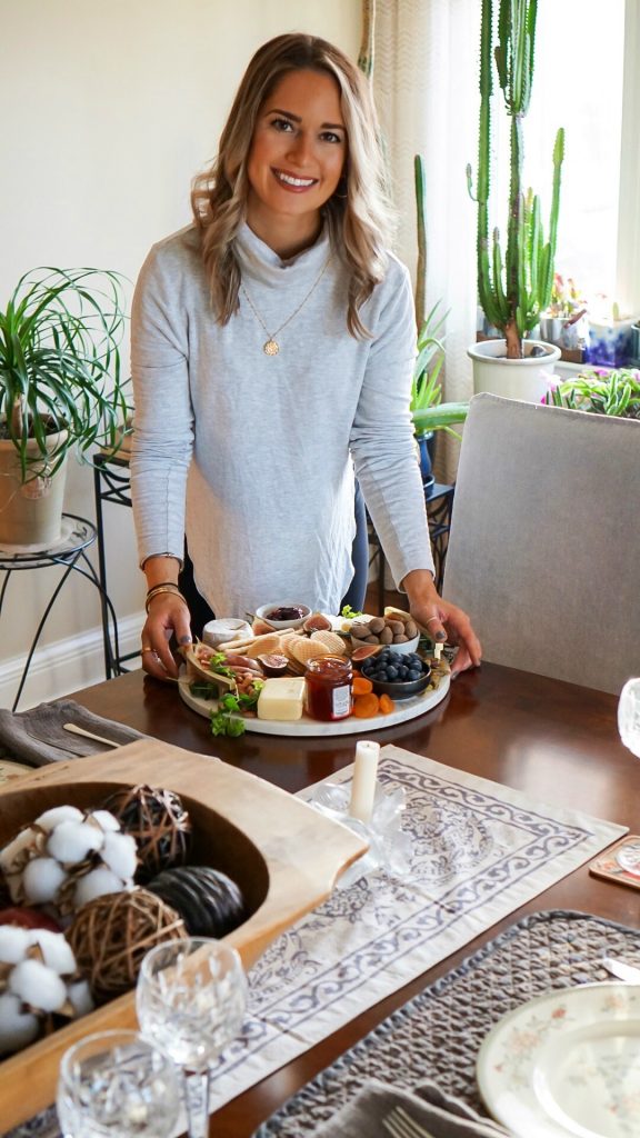 standing next to dining table