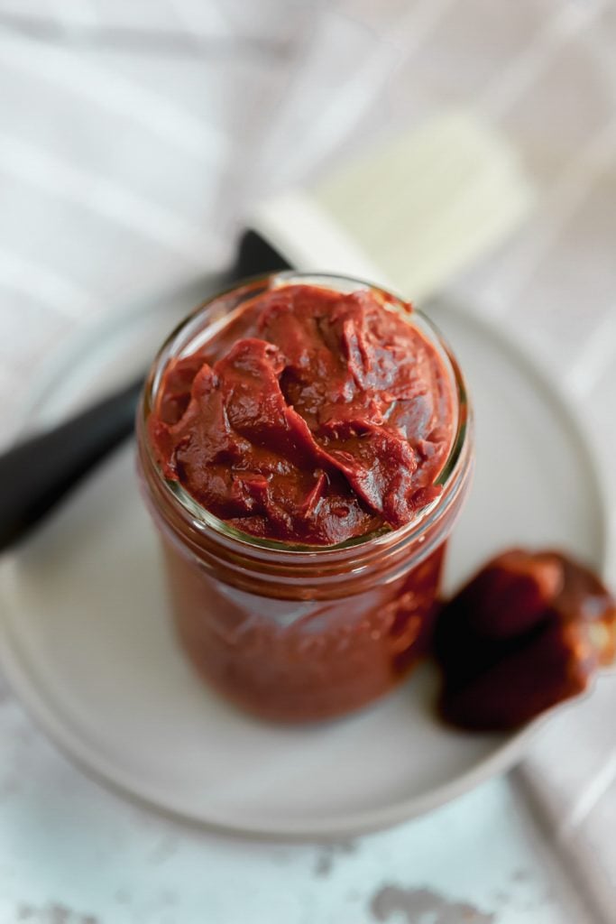 whole30 bbq sauce in a jar on a plate