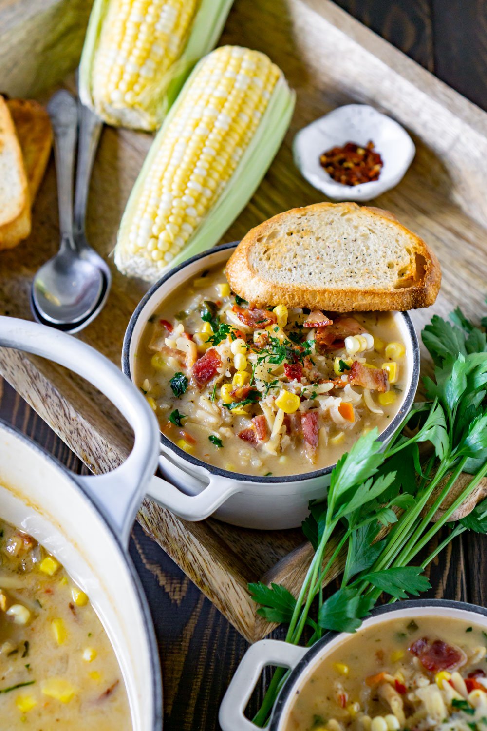 large pot of corn chowder and two small bowls.