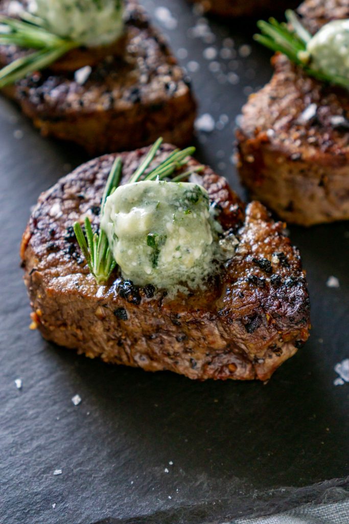 filet mignon on a black slate board