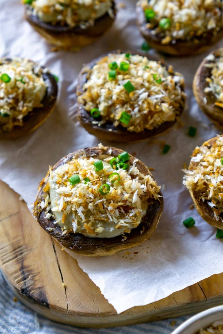 blue cheese stuffed mushrooms on a wood tray