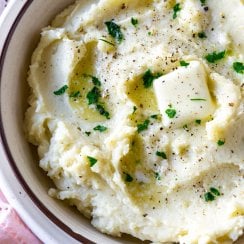 garlic mashed potatoes in a white bowl