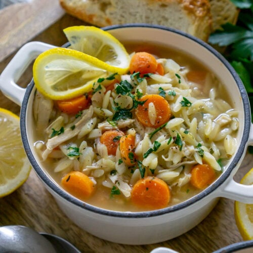 lemon orzo chicken soup in a white bowl