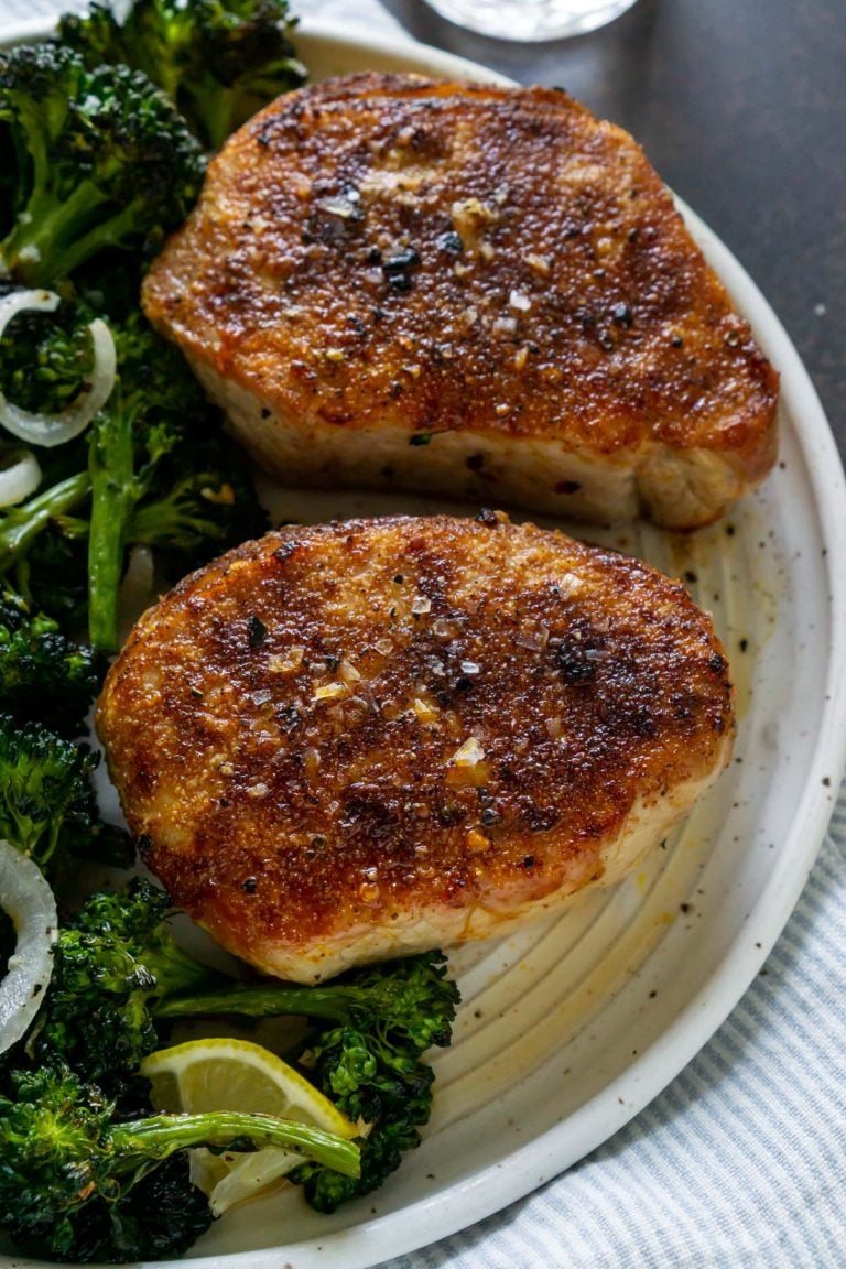 two air fryer pork chops on a white plate