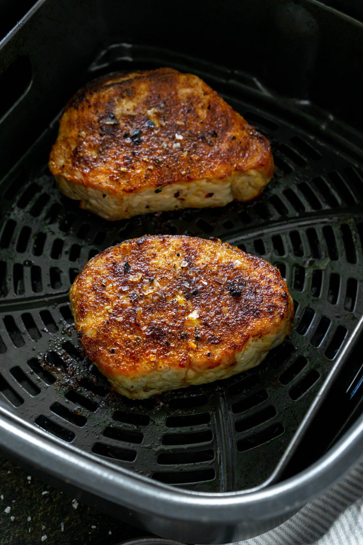 crispy boneless pork chops in air fryer basket
