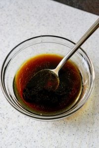salad dressing in a glass bowl with spoon
