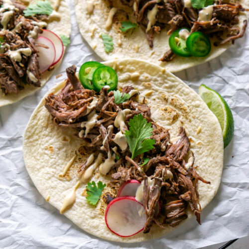 three barbacoa tacoas