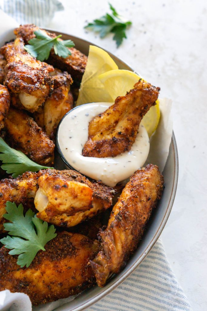 chicken wing dipped in ranch dressing
