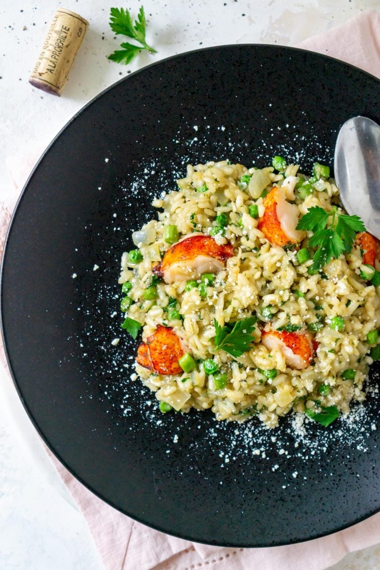 lobster risotto on a black plate