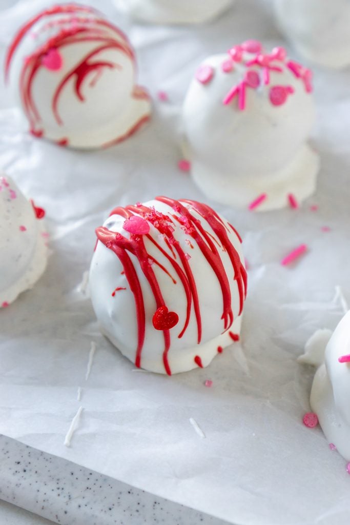 close up of oreo truffle with red striped