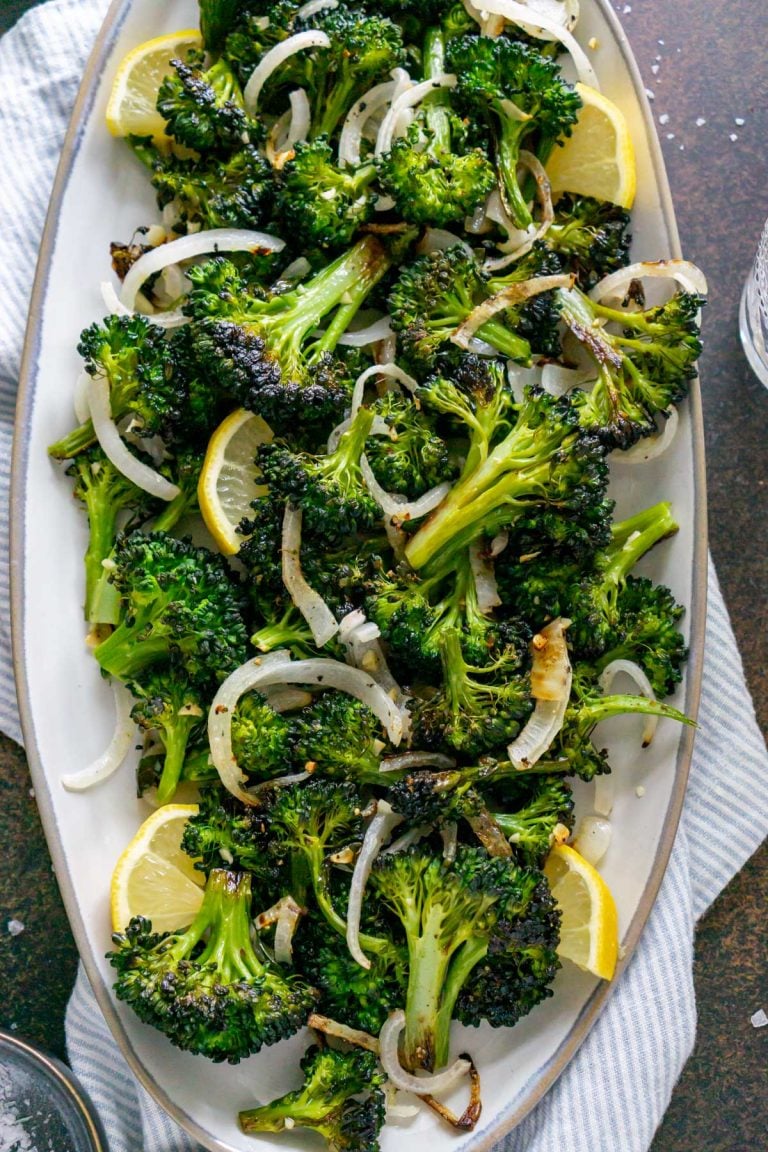 roasted broccolini on a grey serving tray