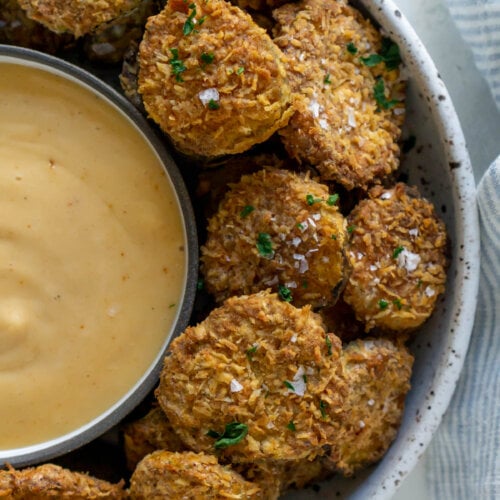 air fryer pickles in a bowl with spicy mayo