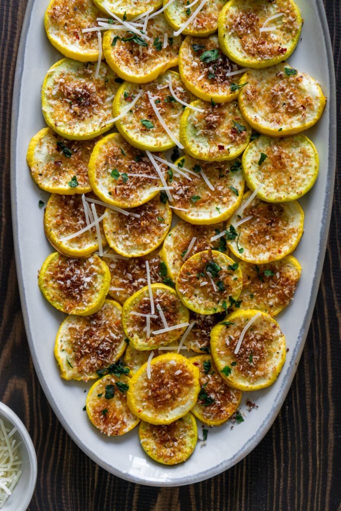 roasted yellow squash on an oval serving tray
