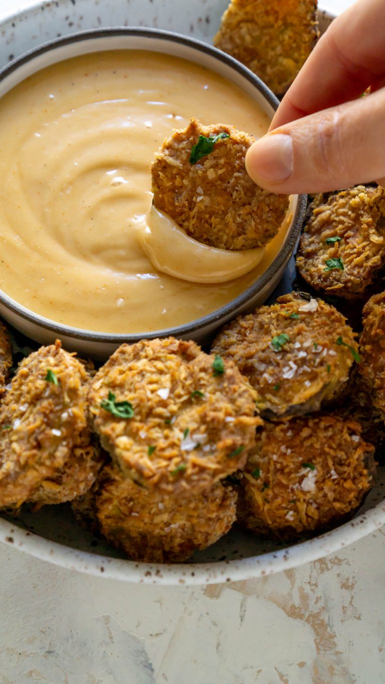 dipping fried pickles in spicy mayo