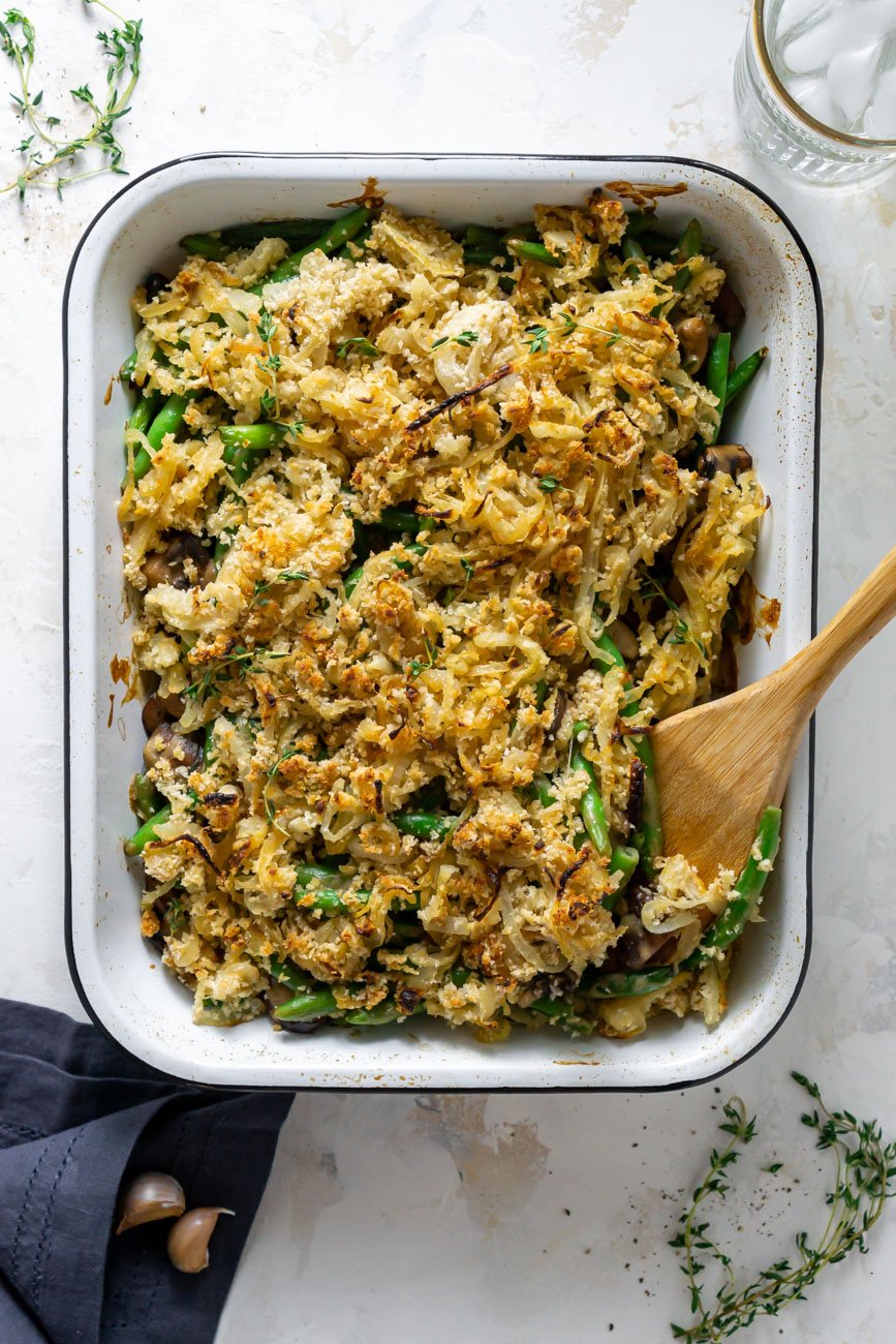 healthy green bean casserole in a white baking dish.