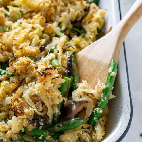 wooden spoon serving healthy green bean casserole