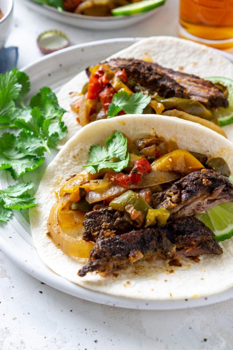 close up of steak fajitas on a plate