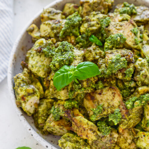 basil pesto chicken in a white bowl