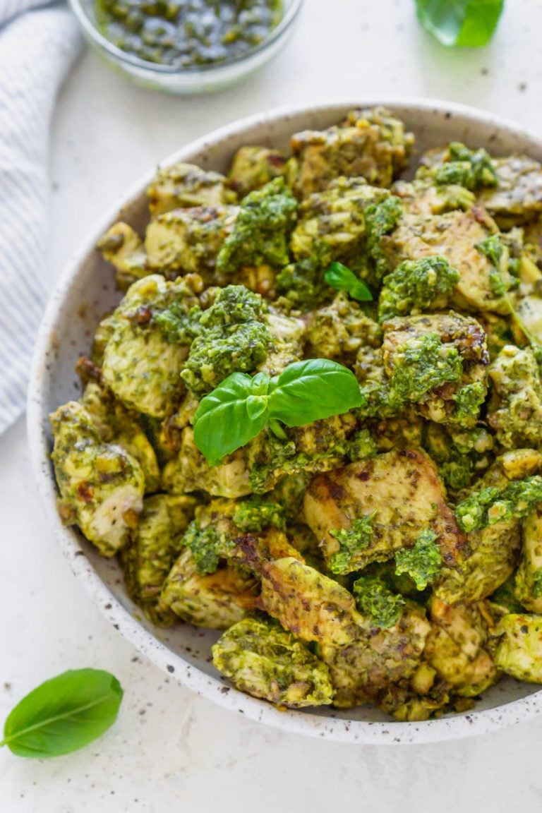 basil pesto chicken in a white bowl