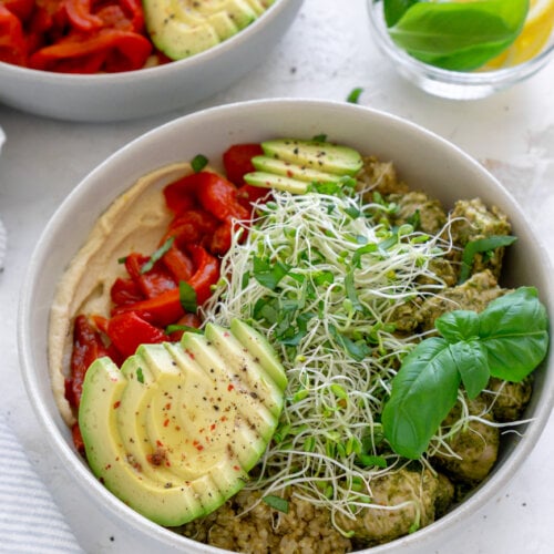 two chicken power bowls and lemon wedges