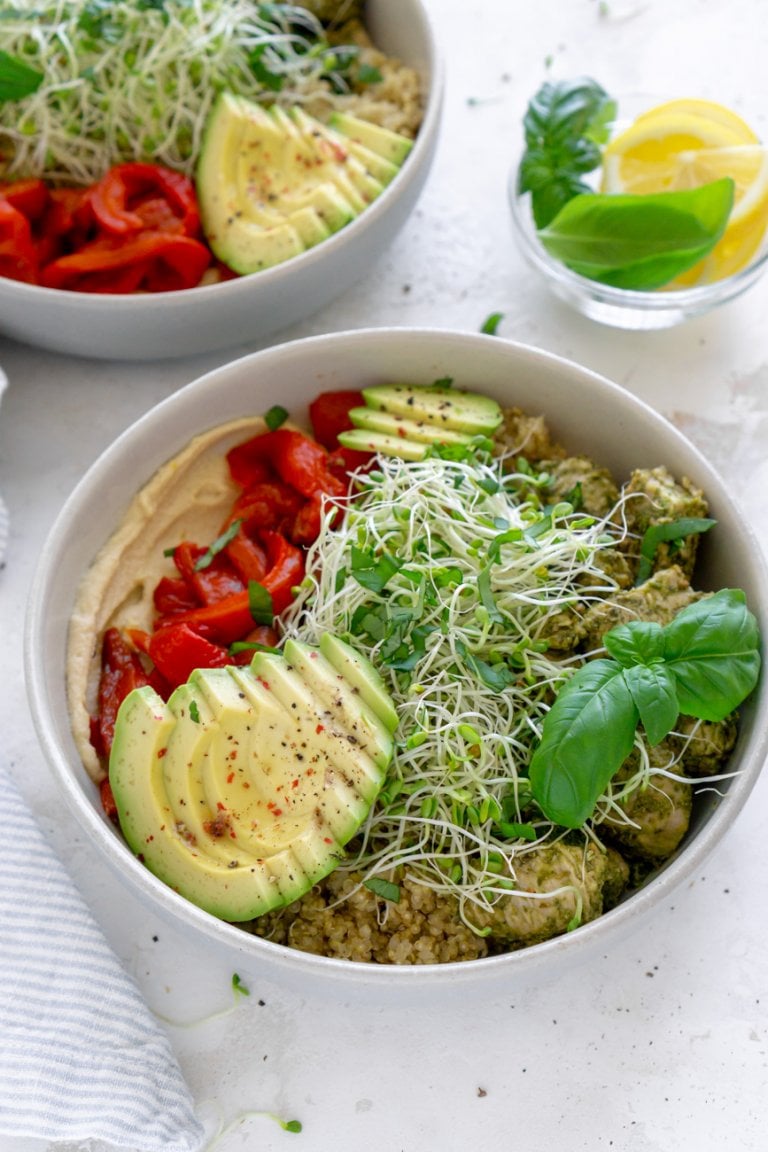 two chicken power bowls and lemon wedges