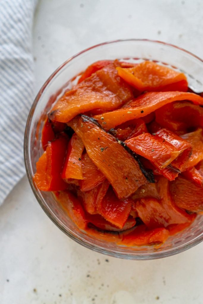 roasted red peppers in a glass bowl