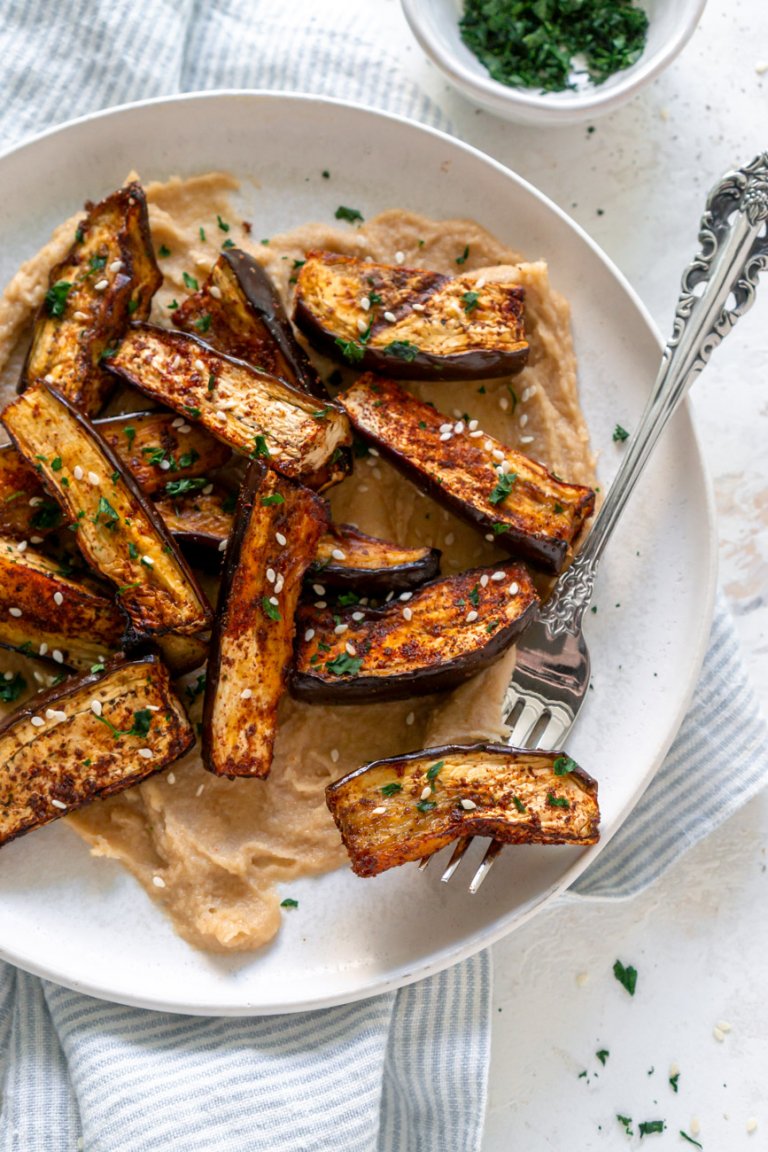 air fryer eggplant fries on a plate with a silver fork