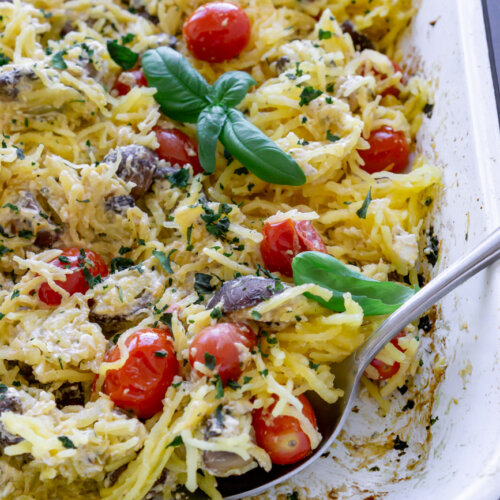 baked spaghetti squash with a silver spoon