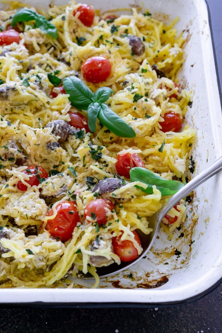 baked spaghetti squash with a silver spoon