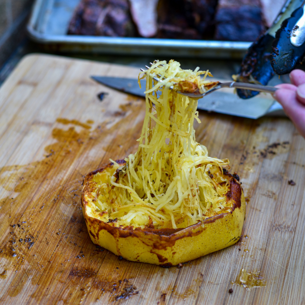 grilled spaghetti squash ring with a fork lifting up the strands