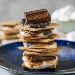 oven baked s'mores stacked on a blue plate