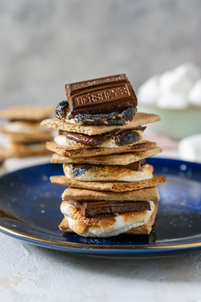 oven baked s'mores stacked on a blue plate