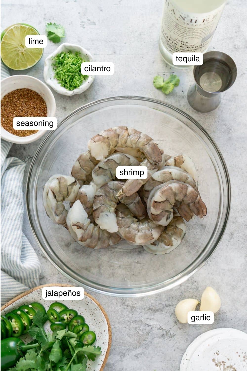 Shrimp and other necessary ingredients portioned out in bowls.