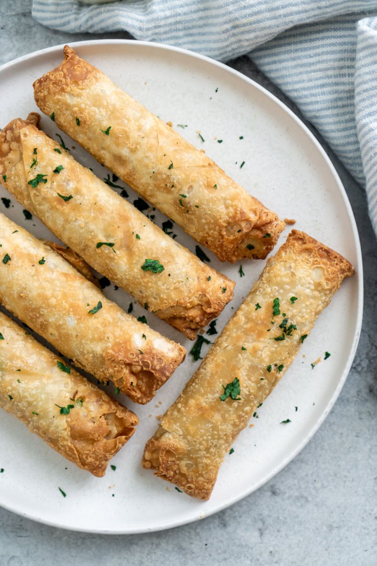 air fryer frozen egg rolls on a white plate