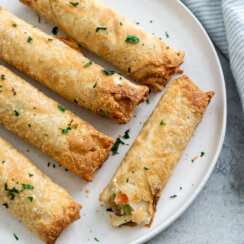 5 air fryer frozen egg rolls with a blue napkin