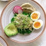 hummus breakfast bowl with eggs and avocado