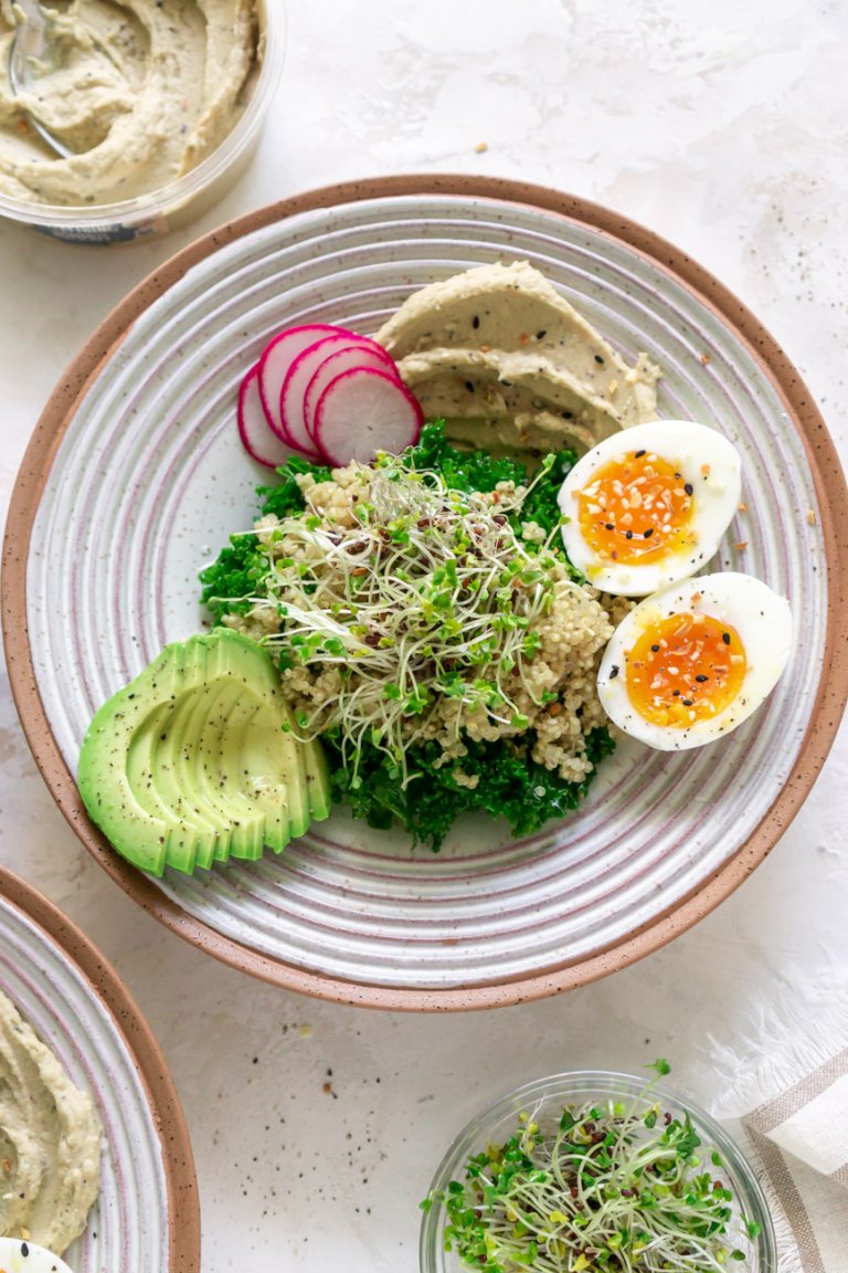 hummus breakfast bowl with eggs and avocado